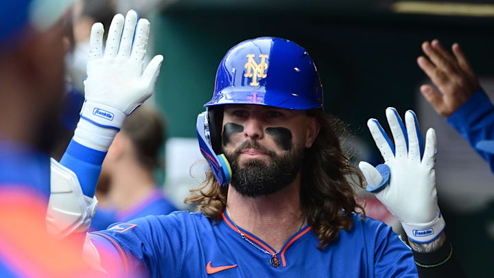 May 4, 2025; St. Louis, Missouri, USA; New York Mets outfielder Jesse Winker (3) is congratulated in the dugout after hitting a sacrifice fly to left, scoring teammate Juan Soto (not shown) against the St. Louis Cardinals at Busch Stadium. Mandatory Credit: Tim Vizer-Imagn Images