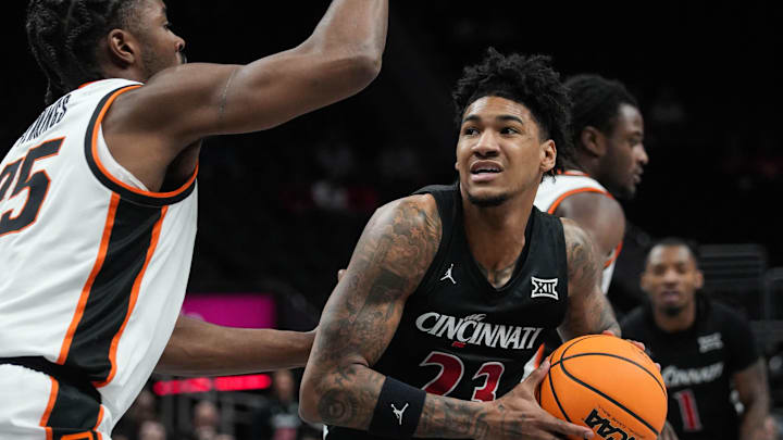 Bearcats Dillon Mitchell (23) looks for a shot during Game 1 of the 2025 Phillips 66 Big 12 Basketball Championship against the Oklahoma State Cowboys at the T-Mobile Center in Kansas City, Missouri on Tuesday March 11, 2025. Bearcats lead the game at halftime with a score of 38-26.