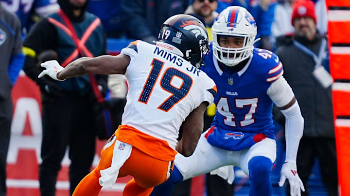 Buffalo Bills cornerback Christian Benford (47) gets ready to tackle Denver Broncos wide receiver Marvin Mims Jr. (19) in Orchard Park on Jan. 12, 2025.