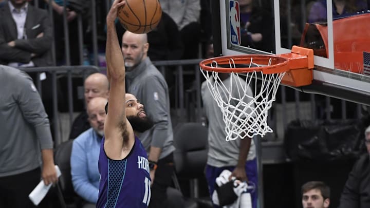 Jan 20, 2025; Charlotte, North Carolina, USA;  Charlotte Hornets forward Cody Martin (11) drives in during the second half against the Dallas Mavericks at the Spectrum Center. Mandatory Credit: Sam Sharpe-Imagn Images