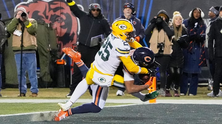 Dec 20, 2025; Chicago, Illinois, USA; Chicago Bears wide receiver DJ Moore (2) catches the game-winning forty-six yard touchdown pass thrown by quarterback Caleb Williams (not pictured) against Green Bay Packers cornerback Keisean Nixon (25) in overtime at Soldier Field. Mandatory Credit: David Banks-Imagn Images