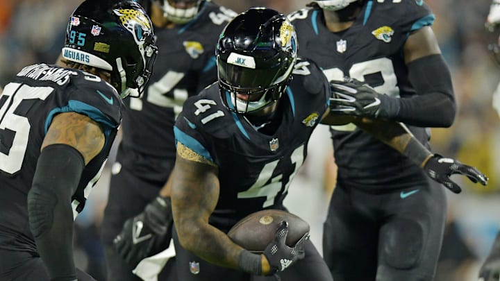 Jacksonville Jaguars linebacker Josh Allen (41) celebrates with teammates after interception a Cincinnati Bengals pass during fourth quarter action. The Jacksonville Jaguars hosted the Cincinnati Bengals at EverBank Stadium in Jacksonville, Florida for Monday Night Football, December 4, 2023. The Jaguars were tied 14 to 14 at the end of the first half an fell in overtime with a final score of 34 to 31. [Bob Self/Florida Times-Union]