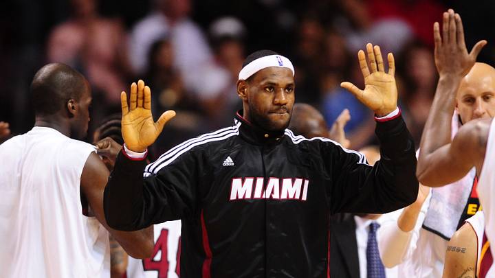 Nov. 17, 2010; Miami, FL, USA; Miami Heat forward LeBron James high fives teammates in the second half against the Phoenix Suns at the American Airlines Arena. Miami defeated Phoenix 123-96. Mandatory Credit: Mark J. Rebilas-USA TODAY Sports