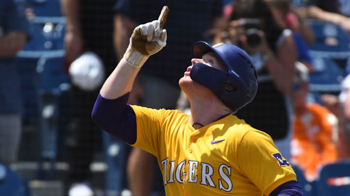 May 26 2024; Hoover, AL, USA; LSU batter Jared Jones (22) gestures heavenward as he enjoys his home run trot after hitting a solo shot to left against Tennessee at the Hoover Met during the championship game of the SEC Tournament.