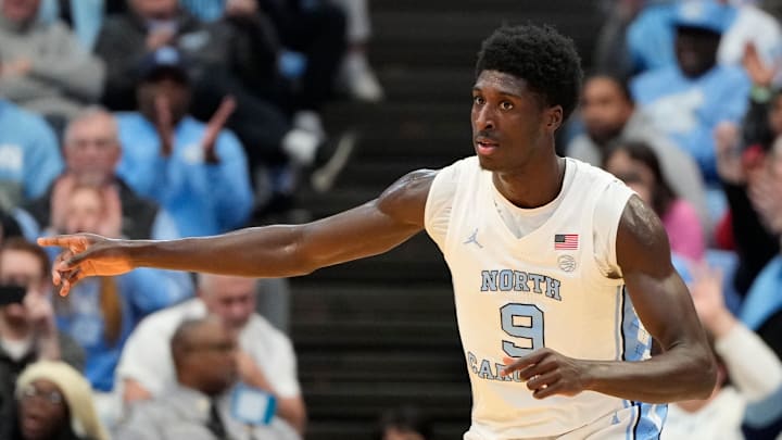 Jan 7, 2025; Chapel Hill, North Carolina, USA; North Carolina Tar Heels guard Drake Powell (9) signals to the passer for the assist in the first half at Dean E. Smith Center.