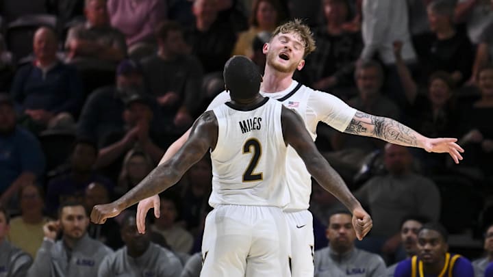 Jan 10, 2026; Nashville, Tennessee, USA; Vanderbilt Commodores guard Duke Miles (2) celebrates the made three of forward Tyler Nickel (5) against the Louisiana State Tigers during the first half at Memorial Gymnasium. Mandatory Credit: Steve Roberts-Imagn Images