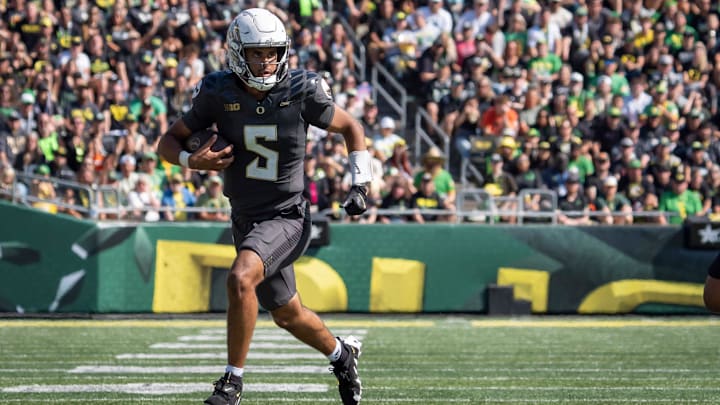 Oregon Ducks quarterback Dante Moore carries the ball as the Oregon Ducks host the Oregon State Beavers Sept. 20, 2025, at Autzen Stadium in Eugene, Oregon. Oregon Ducks quarterback Dante Moore carries the ball as the Oregon Ducks host the Oregon State Beavers Sept. 20, 2025, at Autzen Stadium in Eugene, Oregon.