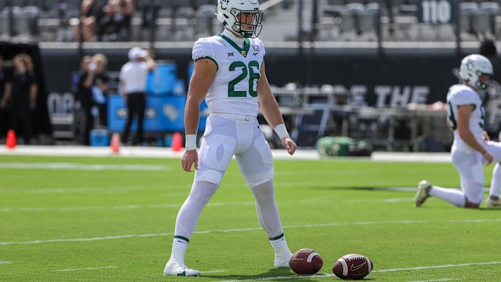 Sep 30, 2023; Orlando, Florida, USA; Baylor Bears long snapper Garrison Grimes (26) warms up before the game against the UCF Knights at FBC Mortgage Stadium. Mandatory Credit: Mike Watters-Imagn Images