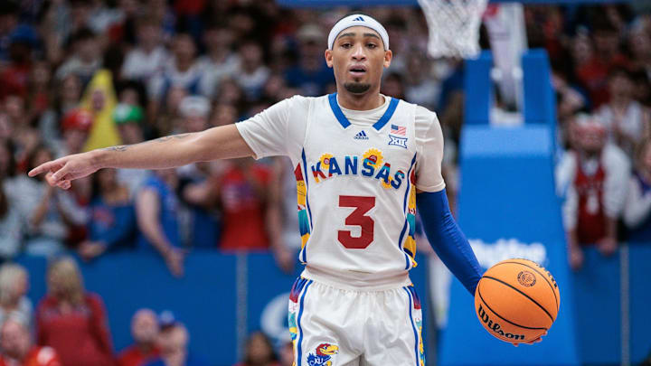 Feb 10, 2024; Lawrence, Kansas, USA; Kansas Jayhawks guard Dajuan Harris Jr. (3) sets the play