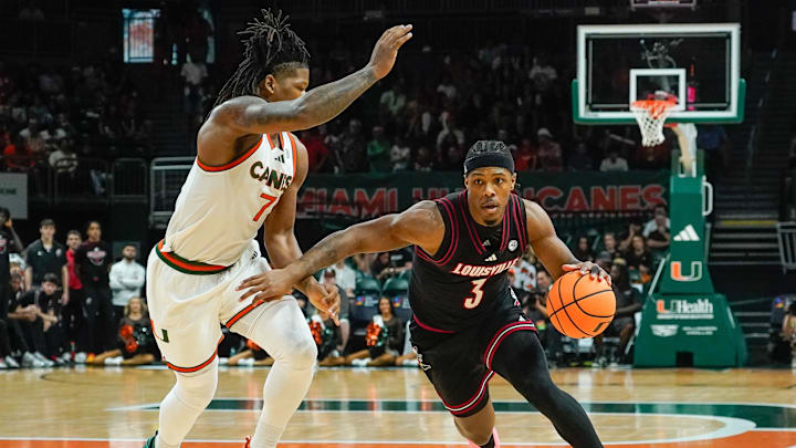 Mar 7, 2026; Coral Gables, Florida, USA; Louisville Cardinals guard Ryan Conwell (3) dribbles the ball against Miami Hurricanes forward Shelton Henderson (7) at Watsco Center. Mandatory Credit: Jeff Romance-Imagn Images