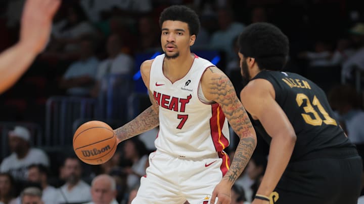 Miami Heat center Kel'el Ware (7) dribbles the basketball as Cleveland Cavaliers center Jarrett Allen (31) defends in the third quarter during game three for the first round of the 2025 NBA Playoffs at Kaseya Center.