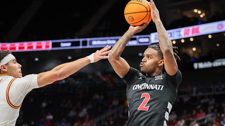 Mar 12, 2025; Kansas City, MO, USA; Cincinnati Bearcats guard Jizzle James (2) shoots the ball during the second half against the Iowa State Cyclones at T-Mobile Center. Mandatory Credit: William Purnell-Imagn Images