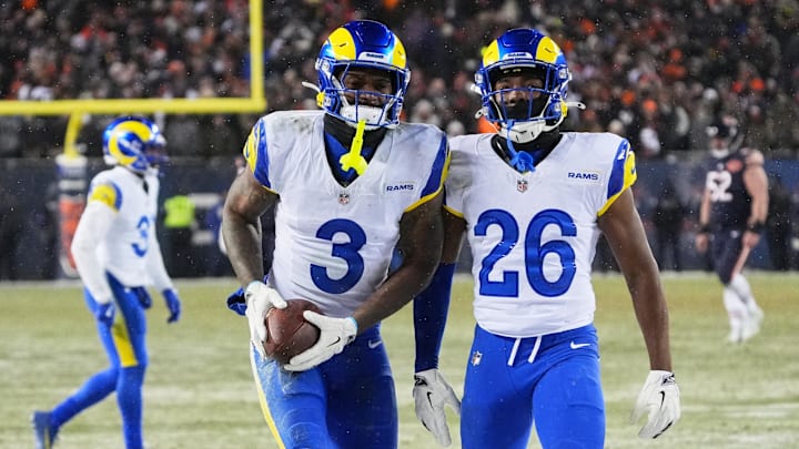 Rams safety Kam Curl celebrates with safety Kamren Kinchens  after intercepting the pass intended for DJ Moore Sunday.