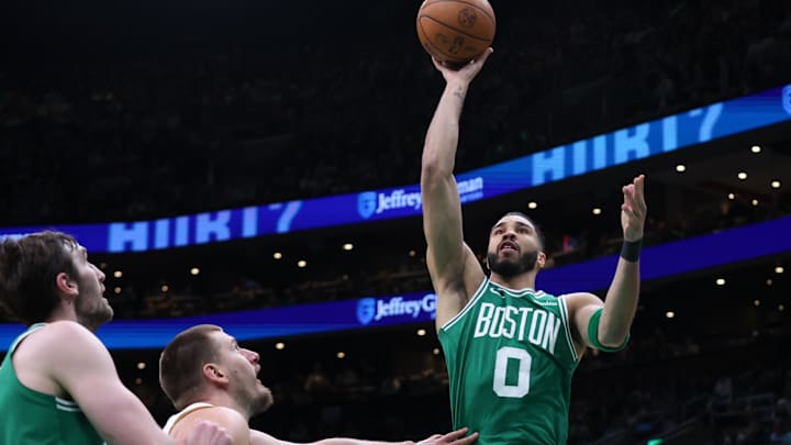 Mar 2, 2025; Boston, Massachusetts, USA; Boston Celtics forward Jayson Tatum (0) shoots during the second half against the Denver Nuggets at TD Garden. Mandatory Credit: Paul Rutherford-Imagn Images