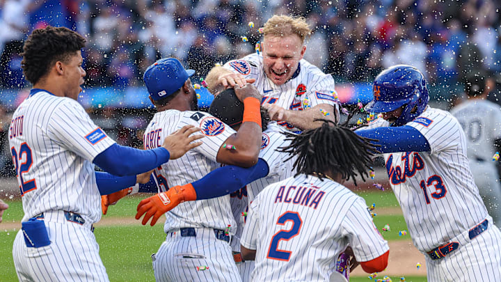 May 26, 2025; New York City, New York, USA; New York Mets shortstop Francisco Lindor (12) celebrates with teammates after hitting a game winning sacrifice fly during the ninth inning against the Chicago White Sox at Citi Field. Mandatory Credit: Vincent Carchietta-Imagn Images