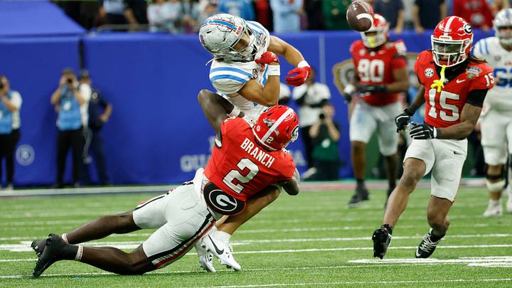 Ole Miss Rebels wide receiver Cayden Lee losses control of the ball as Georgia Bulldogs safety Zion Branch defends in the second half during the 2026 Sugar Bowl 