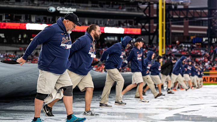Detroit Tigers grounds crew remove the tarp from the field after the rain delay during ALDS Game 3 between Detroit Tigers and Seattle Mariners at Comerica Park in Detroit on Tuesday, Oct. 7, 2025. Detroit Tigers grounds crew remove the tarp from the field after the rain delay during ALDS Game 3 between Detroit Tigers and Seattle Mariners at Comerica Park in Detroit on Tuesday, Oct. 7, 2025.
