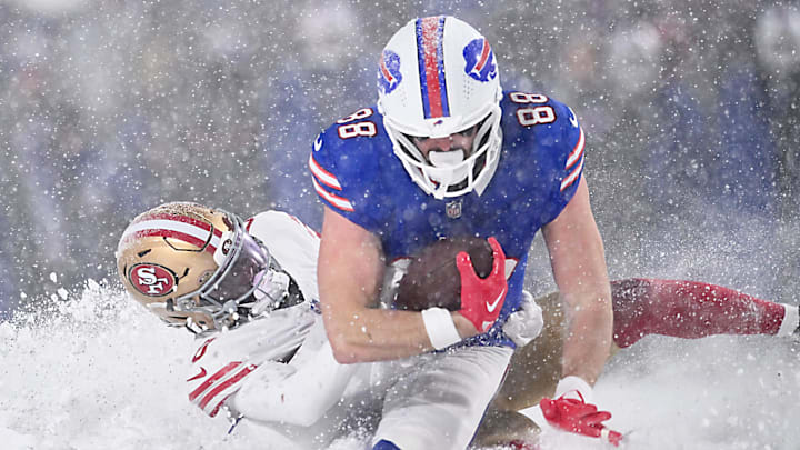 Buffalo Bills tight end Dawson Knox (88) is tackled by San Francisco 49ers safety Malik Mustapha (6) after making a catch in the fourth quarter against the Buffalo Bills at Highmark Stadium. 