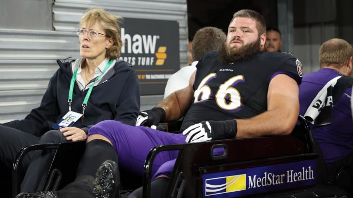 Oct 11, 2021; Baltimore, Maryland, USA; Baltimore Ravens guard Ben Cleveland (66) is carted off the field after being injured against the Indianapolis Colts during the second quarter at M&T Bank Stadium. Mandatory Credit: Geoff Burke-USA TODAY Sports Oct 11, 2021; Baltimore, Maryland, USA; Baltimore Ravens guard Ben Cleveland (66) is carted off the field after being injured against the Indianapolis Colts during the second quarter at M&T Bank Stadium. Mandatory Credit: Geoff Burke-USA TODAY Sports