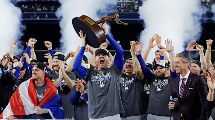 Oct 31, 2024; New York, New York, USA; Los Angeles Dodgers first baseman Freddie Freeman (5) celebrates with the Willie Mays World Series Most Valuable Player Award after being name MVP of the 2024 MLB World Series against the New York Yankees at Yankee Stadium. Mandatory Credit: Brad Penner-Imagn Images