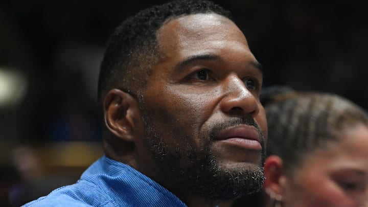 Fox sports personality Michael Strahan looks on during the first half of a game between the Notre Dame Fighting Irish and Duke Blue Devils at Cameron Indoor Stadium. 
