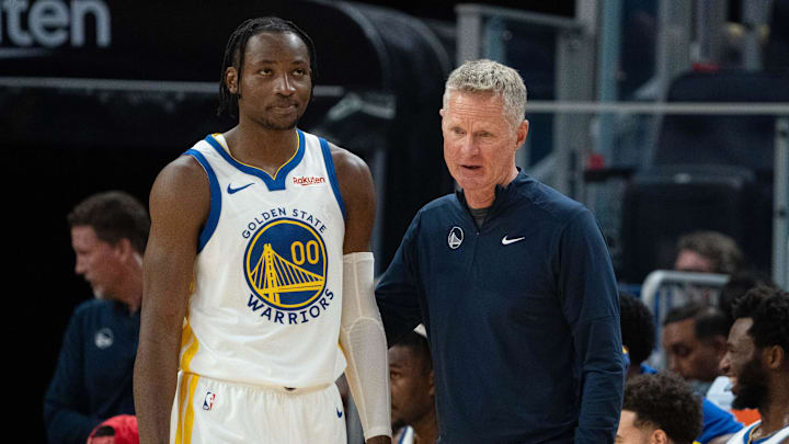 October 20, 2023; San Francisco, California, USA; Golden State Warriors head coach Steve Kerr (right) talks to forward Jonathan Kuminga (00) during the third quarter against the San Antonio Spurs at Chase Center. Mandatory Credit: Kyle Terada-Imagn Images