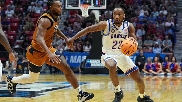 Mar 20, 2026; San Diego, CA, USA; Kansas Jayhawks guard Darryn Peterson (22) controls the ball against California Baptist Lancers guard Martel Williams (33) in the first half during a first round game of the men's 2026 NCAA Tournament at Viejas Arena. Mandatory Credit: Kirby Lee-Imagn Images Mar 20, 2026; San Diego, CA, USA; Kansas Jayhawks guard Darryn Peterson (22) controls the ball against California Baptist Lancers guard Martel Williams (33) in the first half during a first round game of the men's 2026 NCAA Tournament at Viejas Arena. Mandatory Credit: Kirby Lee-Imagn Images