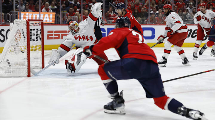 May 8, 2025; Washington, District of Columbia, USA; Washington Capitals defenseman John Carlson (74) scores a goal on Carolina Hurricanes goaltender Frederik Andersen (31) in the third period in game two of the second round of the 2025 Stanley Cup Playoffs at Capital One Arena. Mandatory Credit: Geoff Burke-Imagn Images May 8, 2025; Washington, District of Columbia, USA; Washington Capitals defenseman John Carlson (74) scores a goal on Carolina Hurricanes goaltender Frederik Andersen (31) in the third period in game two of the second round of the 2025 Stanley Cup Playoffs at Capital One Arena. Mandatory Credit: Geoff Burke-Imagn Images