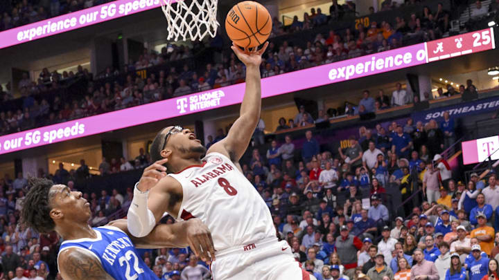 Mar 14, 2025; Nashville, TN, USA; Alabama Crimson Tide guard Chris Youngblood (8) shoots over Kentucky Wildcats center Amari Williams (22) during the first half at Bridgestone Arena. Mandatory Credit: Steve Roberts-Imagn Images Mar 14, 2025; Nashville, TN, USA; Alabama Crimson Tide guard Chris Youngblood (8) shoots over Kentucky Wildcats center Amari Williams (22) during the first half at Bridgestone Arena. Mandatory Credit: Steve Roberts-Imagn Images