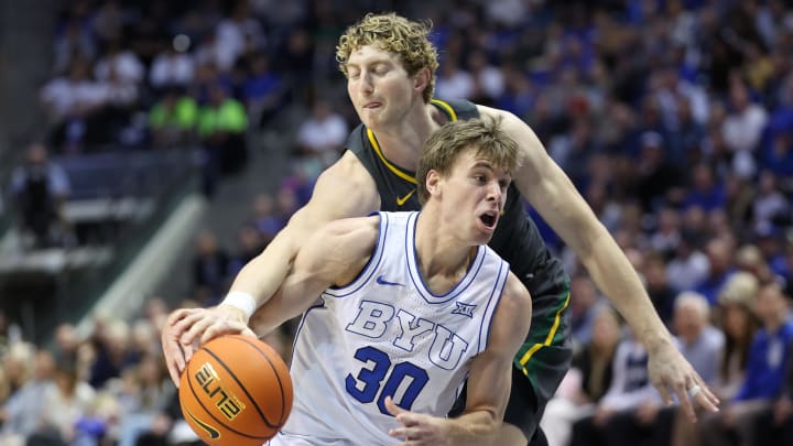 Feb 20, 2024; Provo, Utah, USA; Baylor Bears forward Caleb Lohner (rear) knocks the ball away from