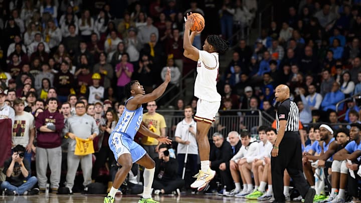 Jan 20, 2024; Chestnut Hill, Massachusetts, USA; Boston College Eagles guard Donald Hand Jr. (13) shoots the ball over North Carolina Tar Heels forward Harrison Ingram (55) during the first half at Conte Forum. Mandatory Credit: Eric Canha-Imagn Images