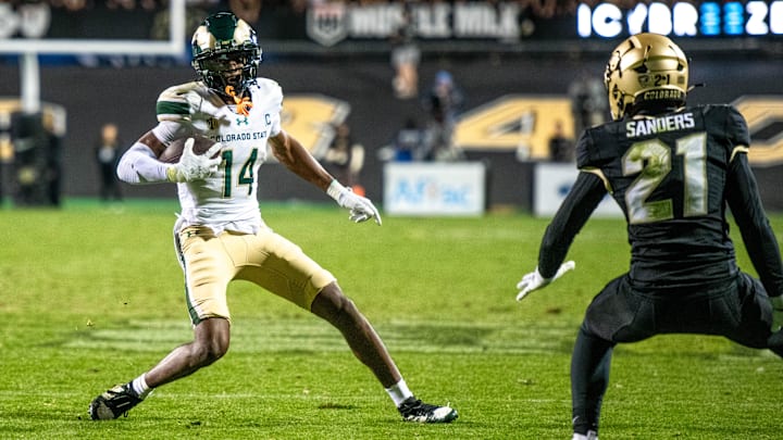CSU football's senior wide receiver Tory Horton (14) makes a move in the open field against CU's Shilo Sanders in the Rocky Mountain Showdown on Sept. 16, 2023 at Folsom Field in Boulder, Colo.