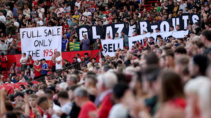 Manchester United's fans display banners during the Premier League clash with Brentford Manchester United's fans display banners during the Premier League clash with Brentford