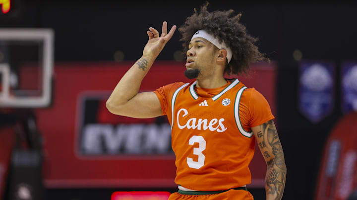 Nov 27, 2025; Kissimmee, Florida, USA; Miami (FL) Hurricanes guard Tre Donaldson (3) reacts after a basket against the Brigham Young University Cougars in the first half at State Farm Field House. Mandatory Credit: Nathan Ray Seebeck-Imagn Images Nov 27, 2025; Kissimmee, Florida, USA; Miami (FL) Hurricanes guard Tre Donaldson (3) reacts after a basket against the Brigham Young University Cougars in the first half at State Farm Field House. Mandatory Credit: Nathan Ray Seebeck-Imagn Images
