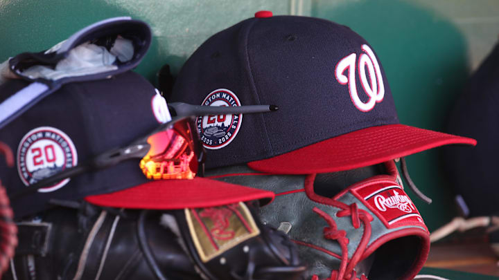 Washington Nationals hats and gloves in the dugout against the Pittsburgh Pirates during the sixth inning at PNC Park. Washington Nationals hats and gloves in the dugout against the Pittsburgh Pirates during the sixth inning at PNC Park.