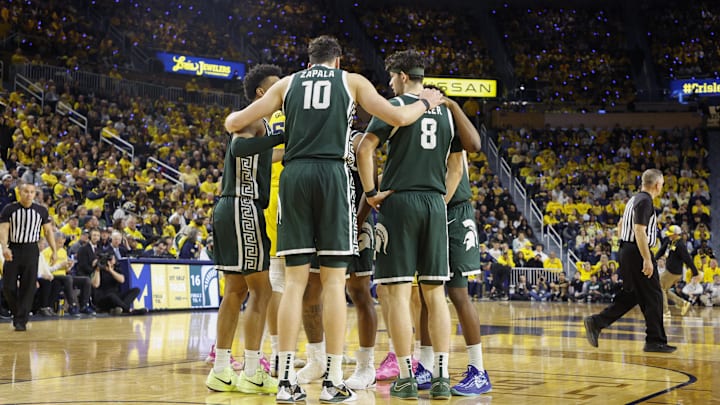 Feb 21, 2025; Ann Arbor, Michigan, USA; Michigan State players huddle during the first half against the Michigan Wolverines at Crisler Center. Mandatory Credit: Brian Bradshaw Sevald-Imagn Images