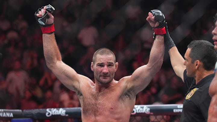 Jun 1, 2024; Newark, New Jersey, USA; Sean Strickland (red gloves)celebrates defeating Paulo Costa (blue gloves) during UFC 302 at Prudential Center. Mandatory Credit: Joe Camporeale-Imagn Images