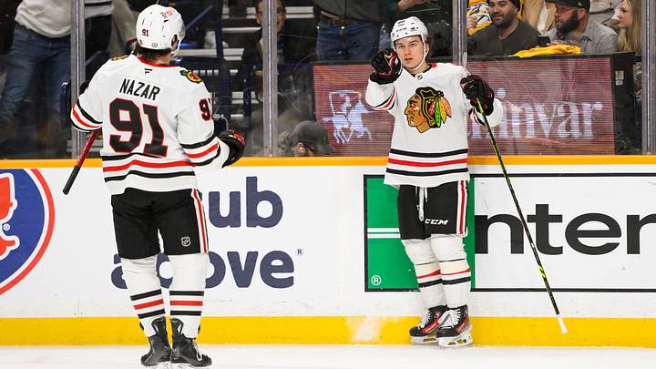 Jan 16, 2025; Nashville, Tennessee, USA;  Chicago Blackhawks center Connor Bedard (98) celebrates his goal with center Frank Nazar (91) against the Nashville Predators during the second period at Bridgestone Arena. Mandatory Credit: Steve Roberts-Imagn Images