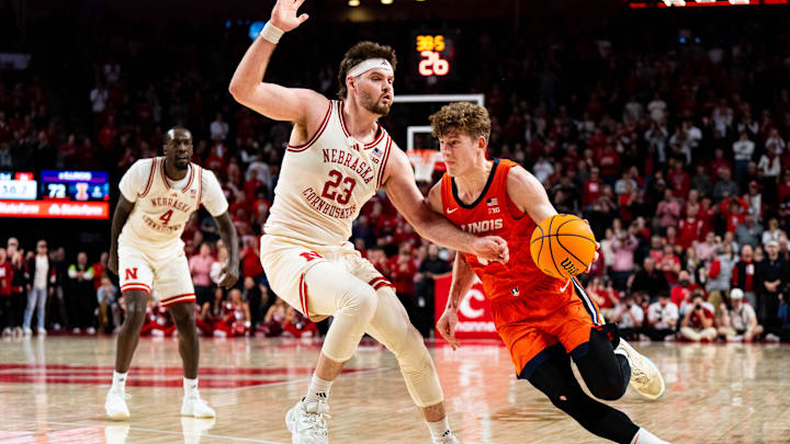Jan 30, 2025; Lincoln, Nebraska, USA; Illinois Fighting Illini guard Kasparas Jakucionis (32) drives against Nebraska Cornhuskers forward Andrew Morgan (23) during overtime at Pinnacle Bank Arena. Mandatory Credit: Dylan Widger-Imagn Images Jan 30, 2025; Lincoln, Nebraska, USA; Illinois Fighting Illini guard Kasparas Jakucionis (32) drives against Nebraska Cornhuskers forward Andrew Morgan (23) during overtime at Pinnacle Bank Arena. Mandatory Credit: Dylan Widger-Imagn Images