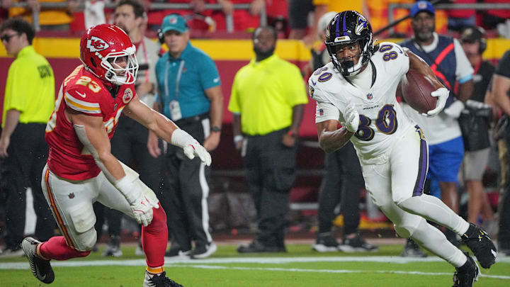 Sep 5, 2024; Kansas City, Missouri, USA; Baltimore Ravens tight end Isaiah Likely (80) runs the ball as Kansas City Chiefs linebacker Drue Tranquill (23) defends during the first half at GEHA Field at Arrowhead Stadium. Mandatory Credit: Denny Medley-Imagn Images Sep 5, 2024; Kansas City, Missouri, USA; Baltimore Ravens tight end Isaiah Likely (80) runs the ball as Kansas City Chiefs linebacker Drue Tranquill (23) defends during the first half at GEHA Field at Arrowhead Stadium. Mandatory Credit: Denny Medley-Imagn Images