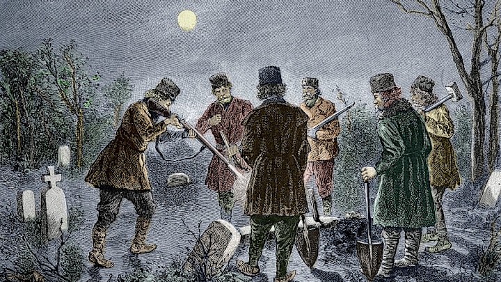 Men prevent a vampire rising from its grave in a Romanian cemetery in this 19th-century illustration.