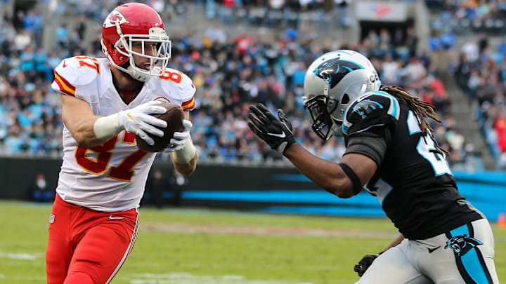 Nov 13, 2016; Charlotte, NC, USA; Kansas City Chiefs tight end Travis Kelce (87) holds out the ball as he scores on a two-point conversion against Carolina Panthers free safety Michael Griffin (22) during the second half at Bank of America Stadium. The Chiefs won 20-17. 