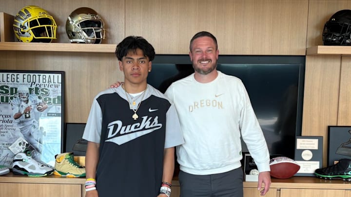 Five-star athlete Honor Fa'alave-Johnson poses with Oregon Ducks coach Dan Lanning