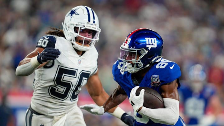 Sep 26, 2024; East Rutherford, NJ, US; New York Giants wide receiver Darius Slayton (86) runs with the ball after a catch while being chased by Dallas Cowboys linebacker Eric Kendricks (50) at MetLife Stadium. Sep 26, 2024; East Rutherford, NJ, US; New York Giants wide receiver Darius Slayton (86) runs with the ball after a catch while being chased by Dallas Cowboys linebacker Eric Kendricks (50) at MetLife Stadium.