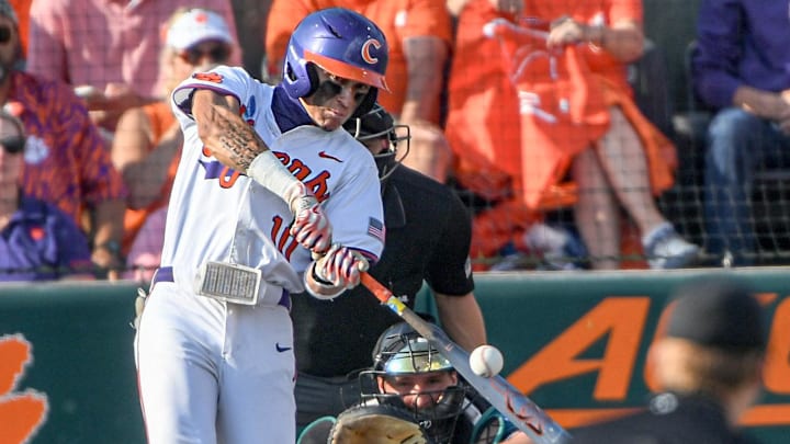 Jun 2, 2024; Clemson, South Carolina, USA; Clemson sophomore Cam Cannarella (10) hits against Coastal Carolina University during the bottom of the first inning of the NCAA baseball Clemson Regional at Doug Kingsmore Stadium in Clemson.