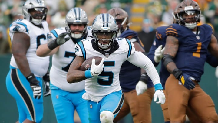 Carolina Panthers running back Rico Dowdle (5) breaks away for a long gain with less than a minute left in the game against the Green Bay Packers during their football game Sunday, November 2, 2025, at Lambeau Field in Green Bay, Wisconsin. Carolina won 16-13.