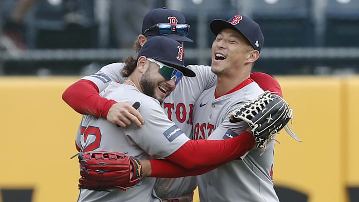 Apr 21, 2024; Pittsburgh, Pennsylvania, USA;  Boston Red Sox left fielder Wilyer Abreu (52) and center fielder Jarren Duran (middle) and right fielder Rob Refsnyder (right) celebrate in the outfield after defeating the Pittsburgh Pirates at PNC Park. Boston won 6-1. Mandatory Credit: Charles LeClaire-Imagn Images