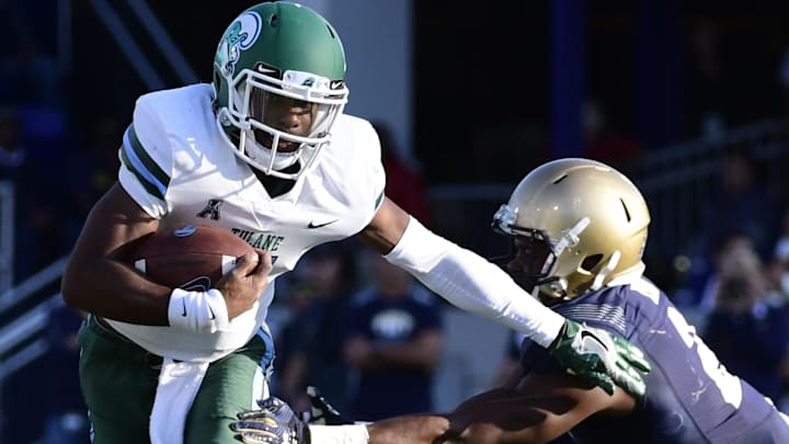 Sep 9, 2017; Annapolis, MD, USA;  Tulane Green Wave quarterback Johnathan Brantley (11) slips past Navy Midshipmen defensive back Michael Onuoha (22) tackle during the third quarter at Navy-Marine Corps Memorial Stadium. Navy Midshipmen defeated Tulane Green Wave 23-21.