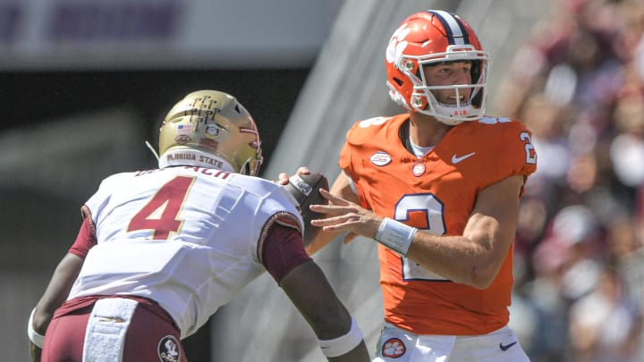 Sep 23, 2023; Clemson, South Carolina, USA; Florida State Seminoles linebacker Karen DeLoach (4) hits Clemson Tigers quarterback Cade Klubnik (2) To knock the ball loose before picking up the fumble and returning it for a touchdown during the third quarter at Memorial Stadium. Mandatory Credit: Ken Ruinard-USA TODAY Sports
