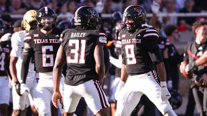 Texas Tech's David Bailey (31) celebrates a sack with teammates Romello Height (9) and John Curry a Big 12 Conference football game, Saturday, Nov. 15, 2025, at Jones AT&T Stadium.